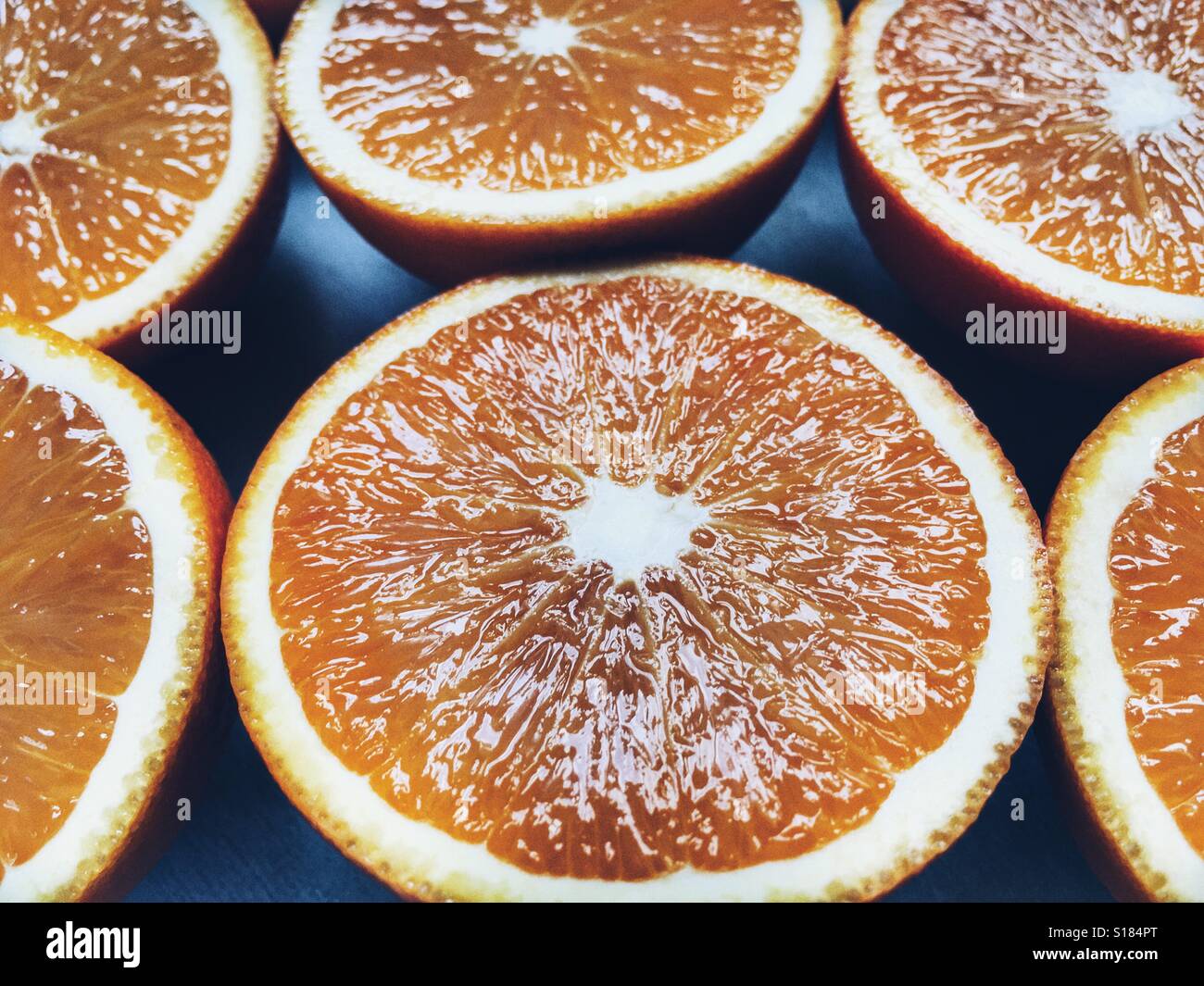 Oranges cut in half, ready for juicing - Smartphone Captured Stock Image