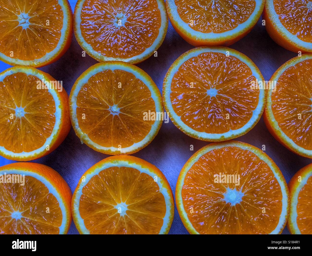 Valencia oranges, cut in half ready for juicing - Smartphone Captured Stock Image