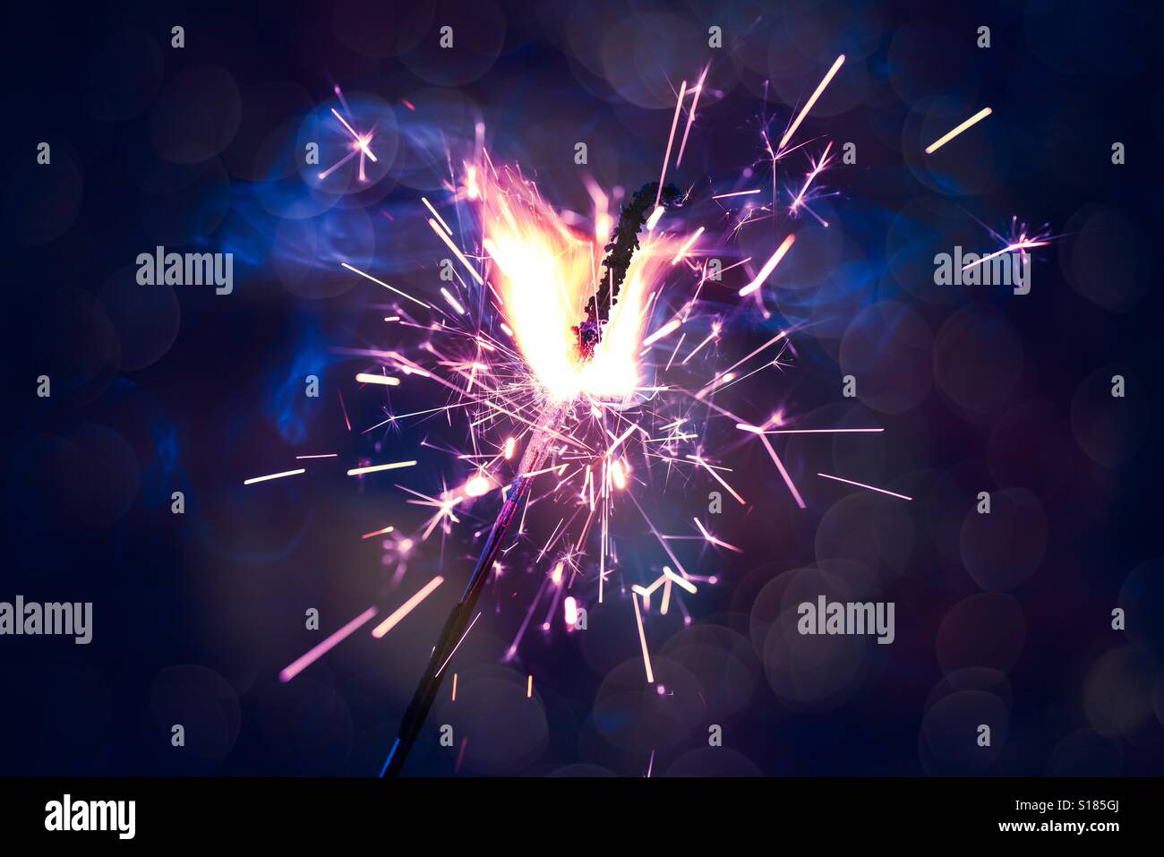 Celebrating new year with sparkles Stock Photo