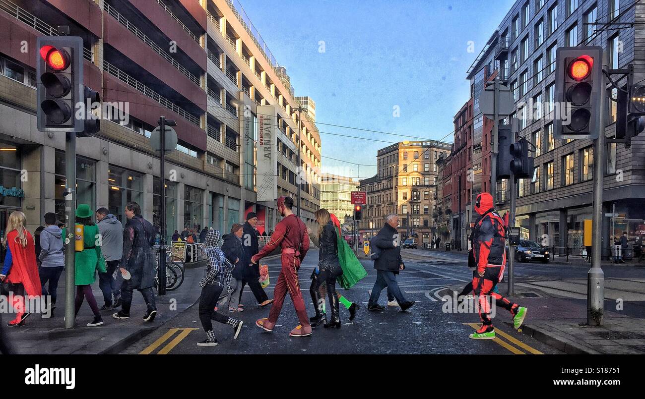Superheroes crossing the road. Stock Photo