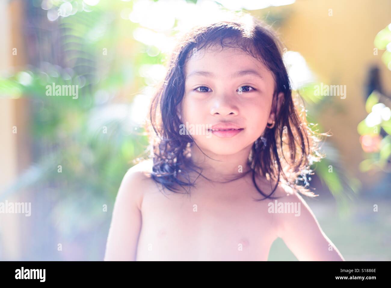 Young girl doing a pose at the garden Stock Photo
