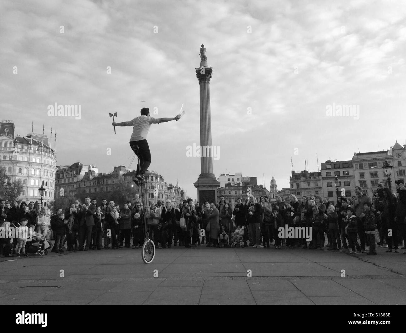 Performer in front of nelson's column Trafalgar Square London Stock Photo
