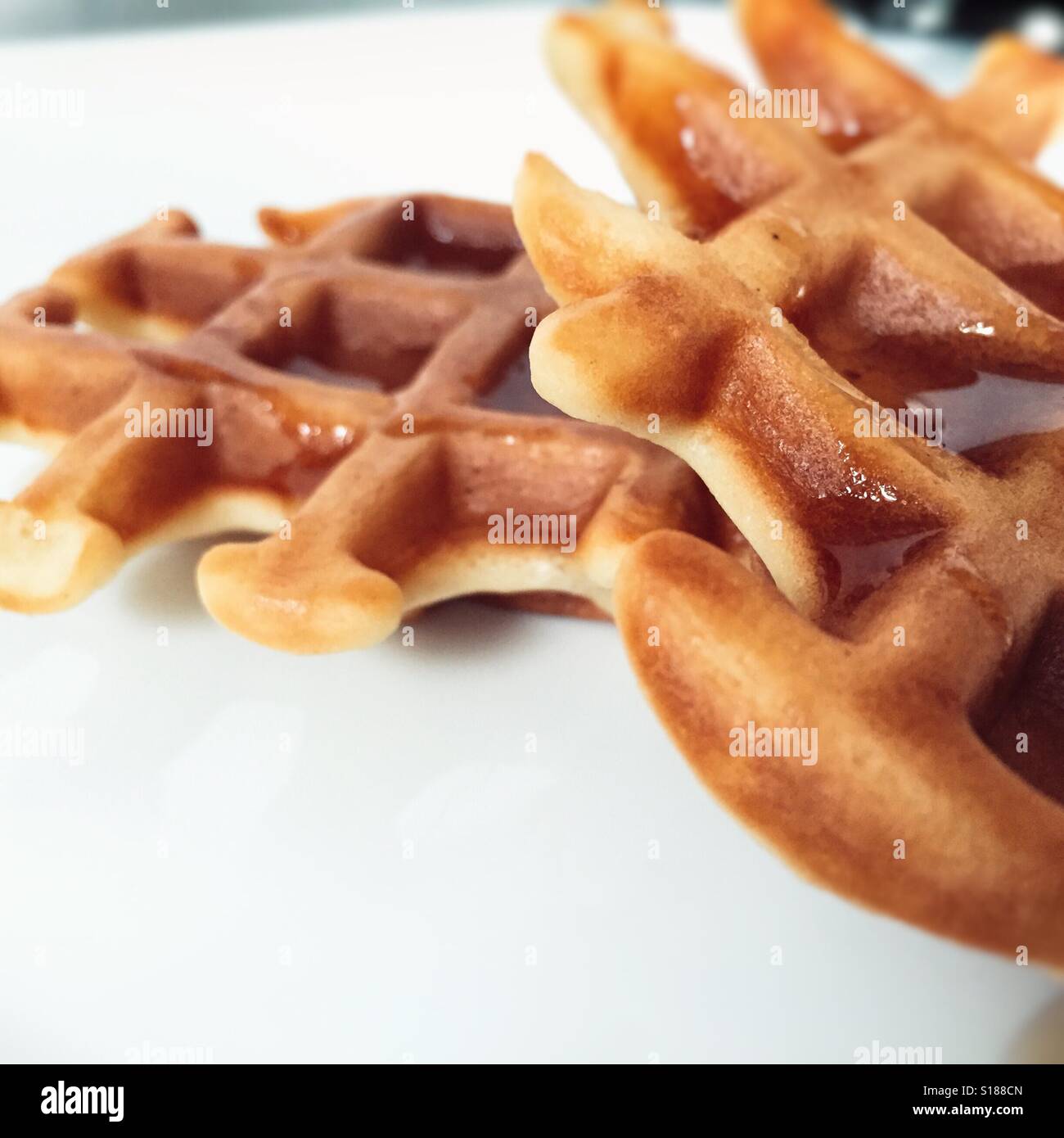 Waffles on white plate. Stock Photo