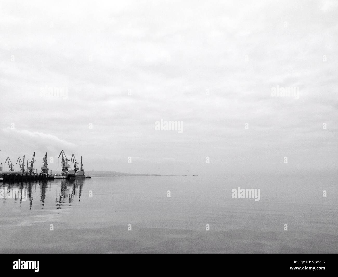 Port cranes, minimal background - Smartphone Captured Stock Image