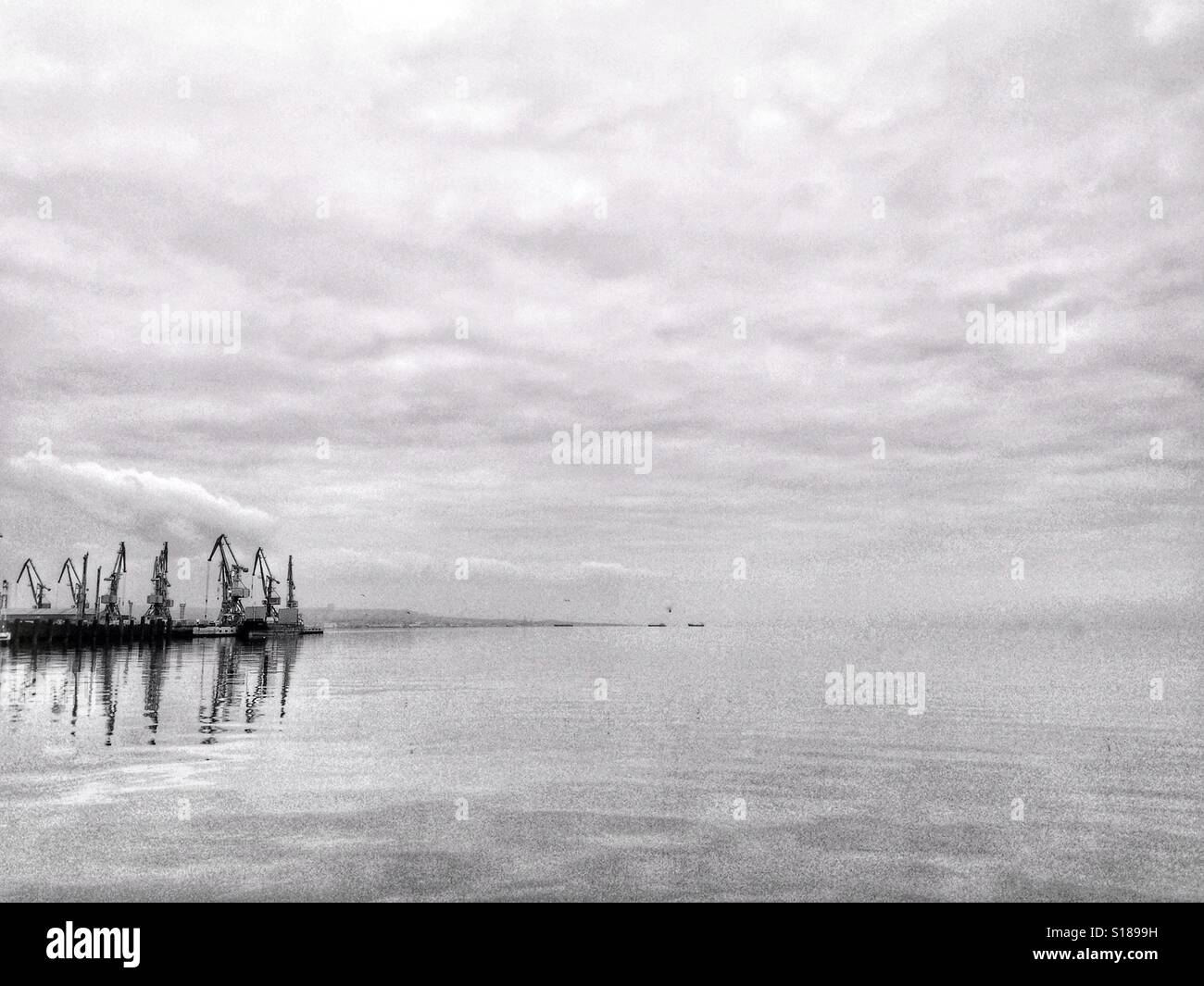 Port cranes, minimal background - Smartphone Captured Stock Image