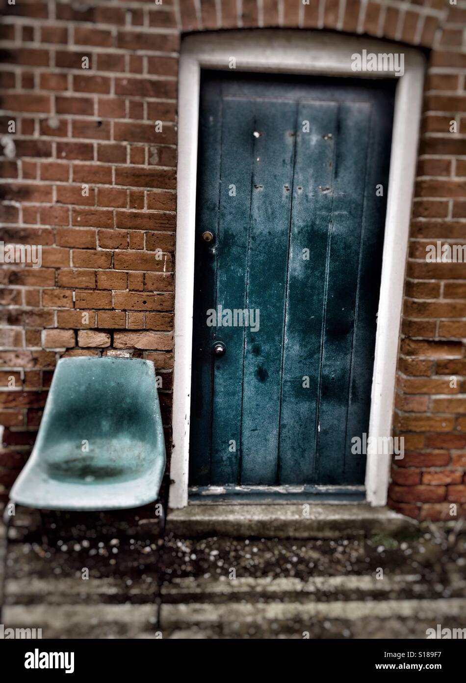 Shed door and plastic chair - Smartphone Captured Stock Image
