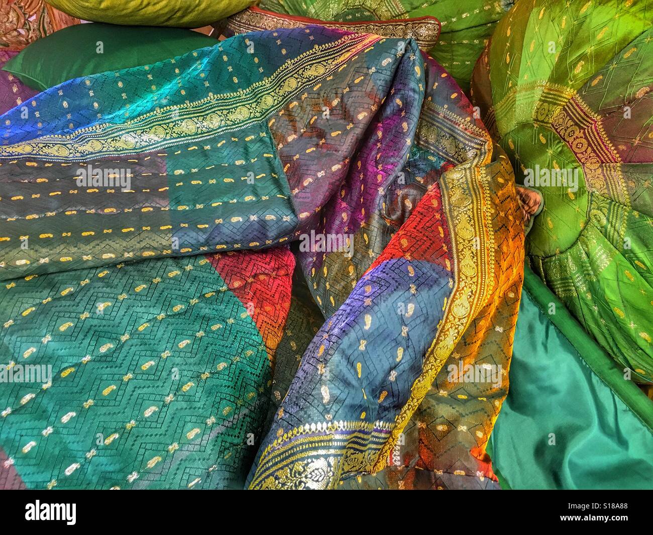 Colorful swathe of material and a green cushion - Smartphone Captured Stock Image