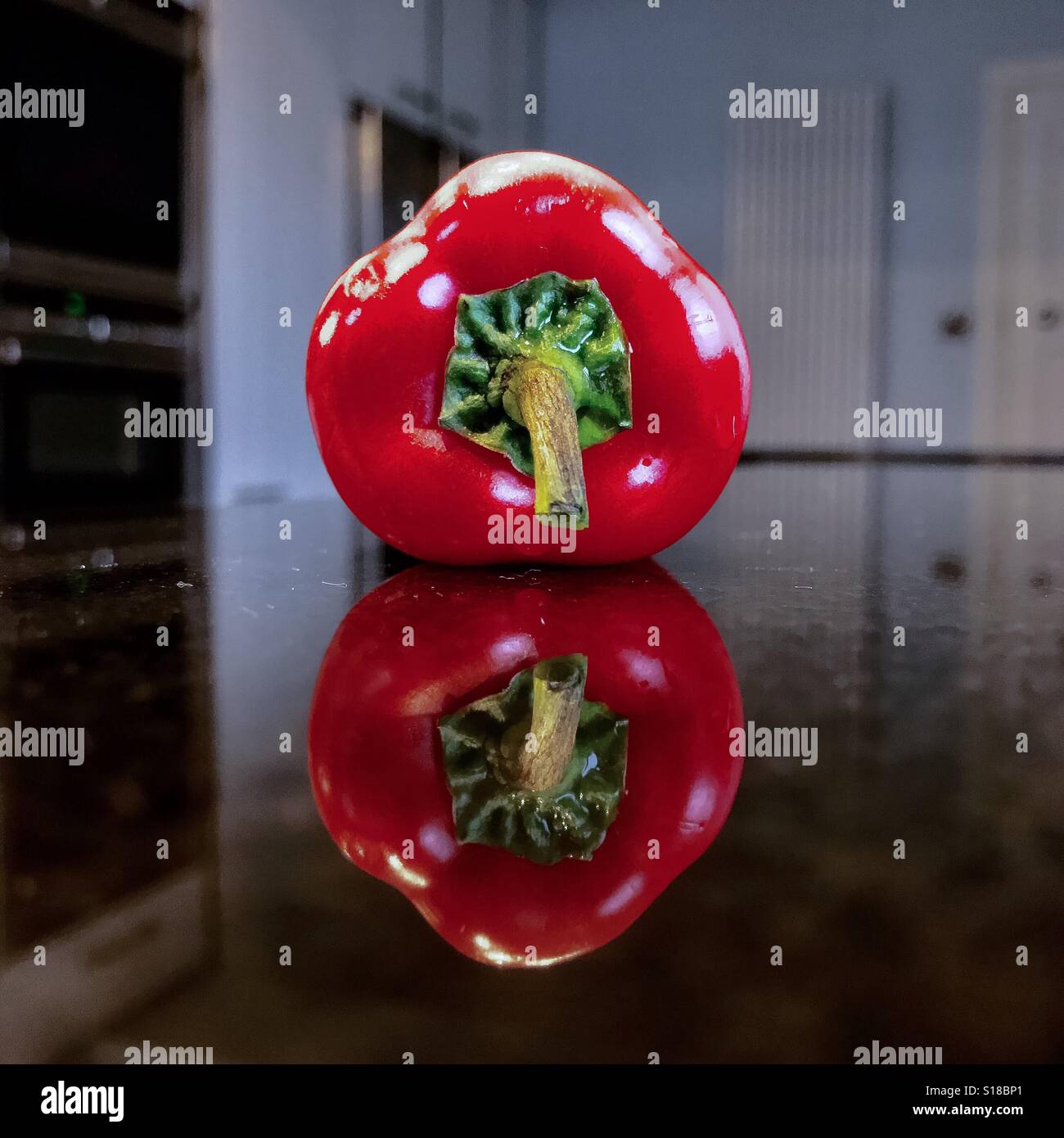 Red pepper reflection Stock Photo