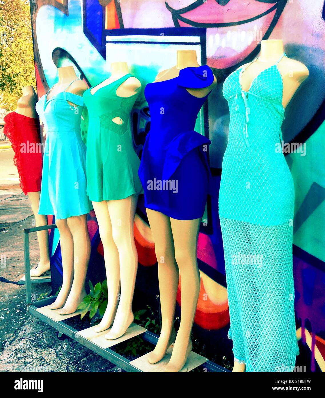 Mannequin clothing display and street art - Smartphone Captured Stock Image