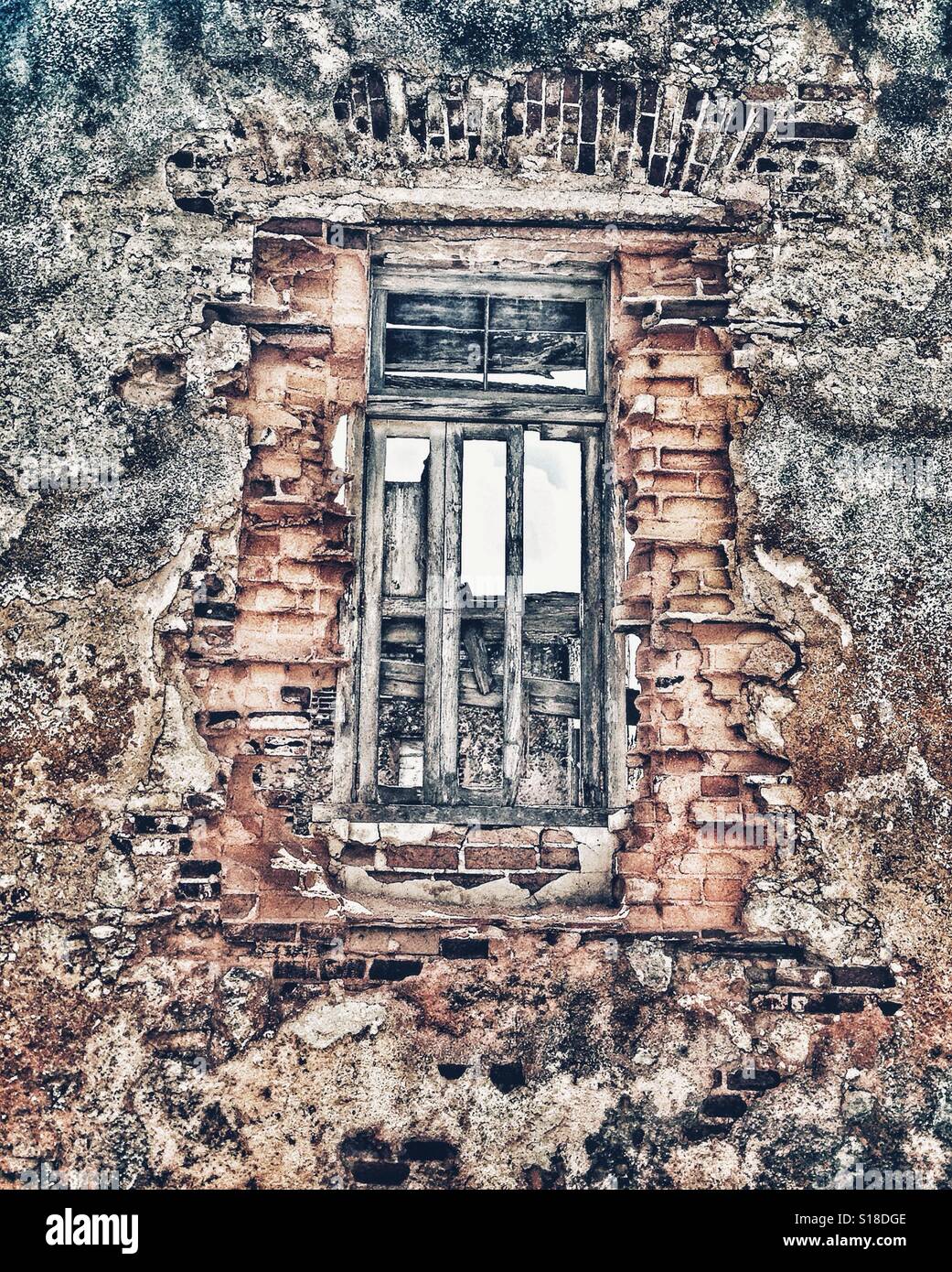 Old wooden window frame in derelict building Stock Photo