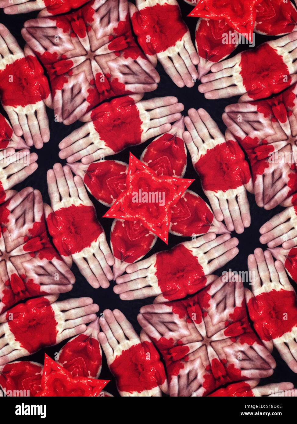 An abstract kaleidoscopic design made from images of human hands with red paint on them Stock Photo