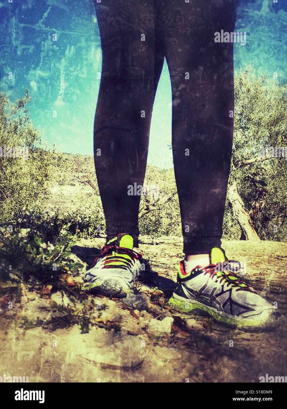 Healthy lifestyle. Taking a break during a cross country run - Smartphone Captured Stock Image