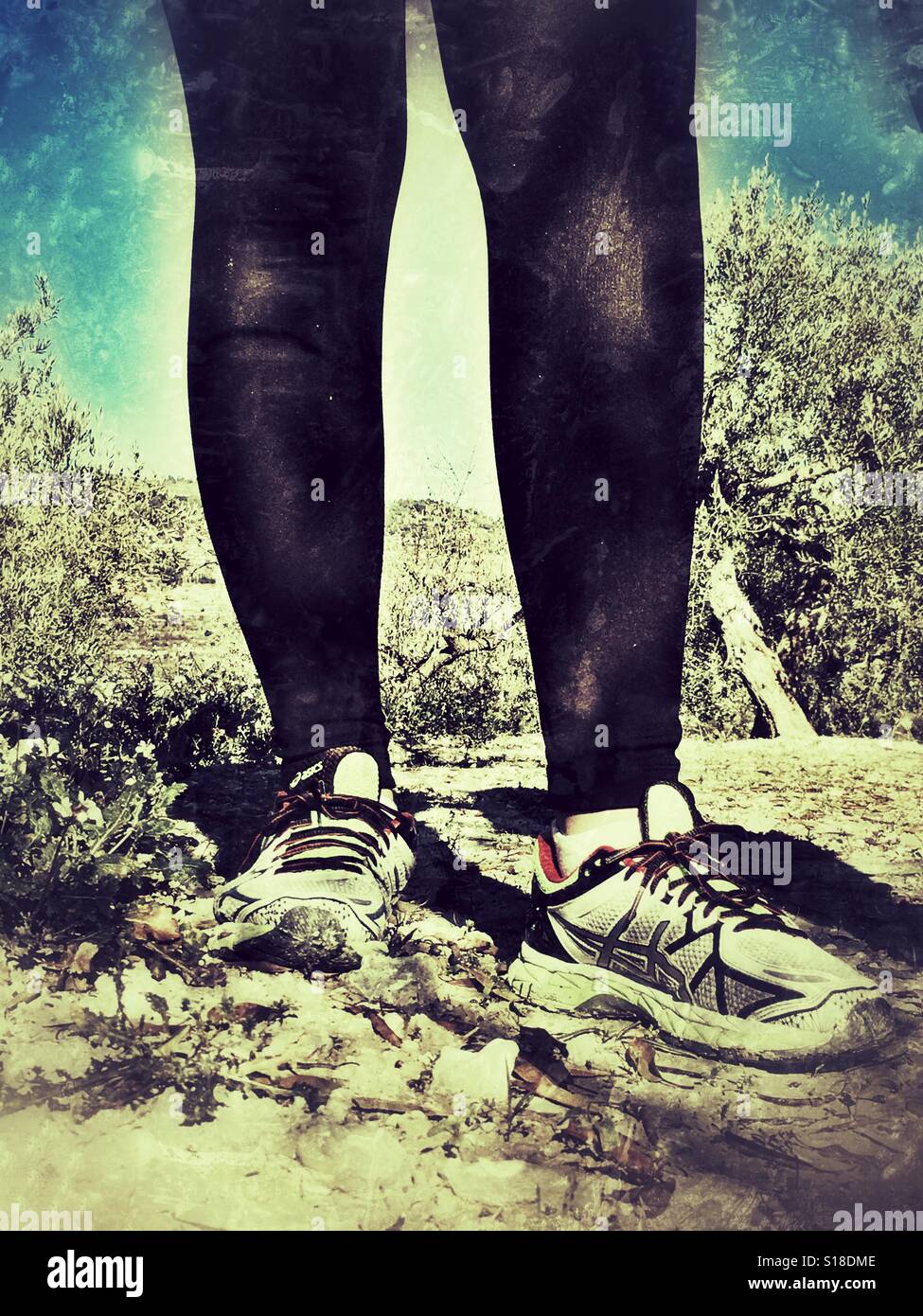 Healthy lifestyle. Taking a break during a cross country run - Smartphone Captured Stock Image