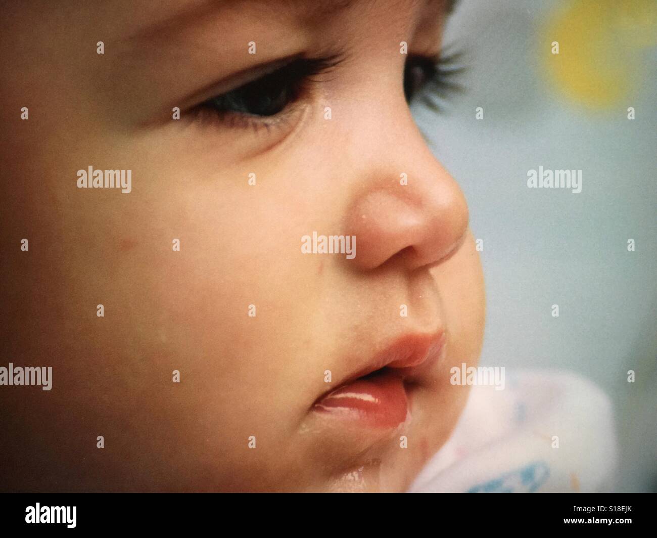 A close up image of a baby girl's face Stock Photo