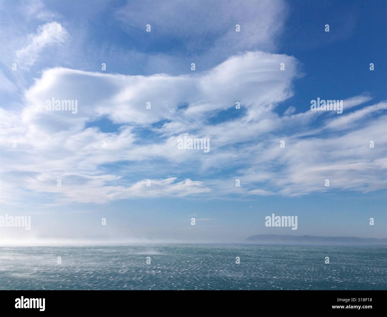 Strong wind blowing over blue sea Stock Photo - Alamy