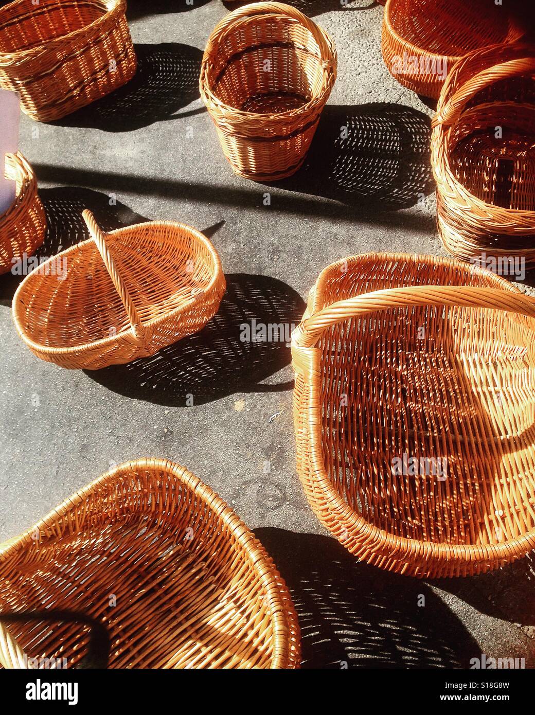 Wicker shopping baskets for sale on a French street market stall Stock Photo Alamy