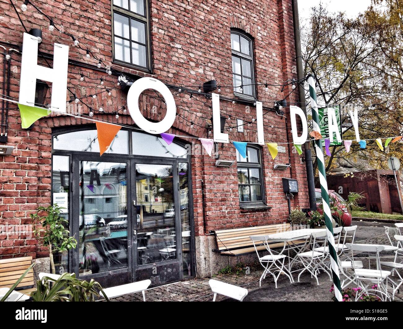 Holiday sign at restaurant terrace - Smartphone Captured Stock Image Holiday sign at restaurant terrace - Smartphone Captured Stock Image