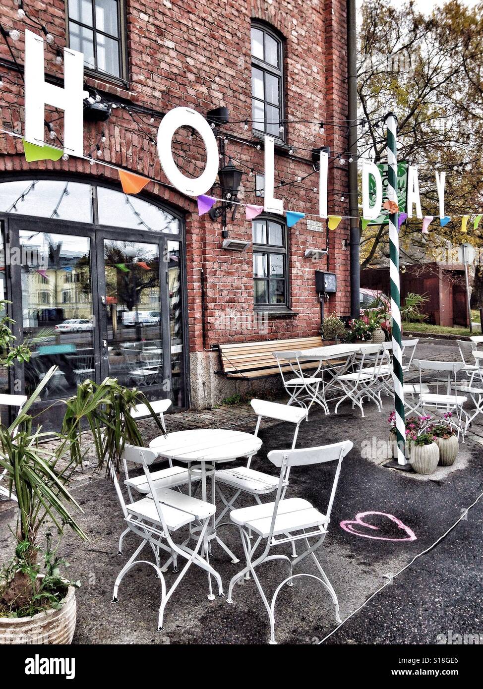 Restaurant terrace with holiday sign - Smartphone Captured Stock Image