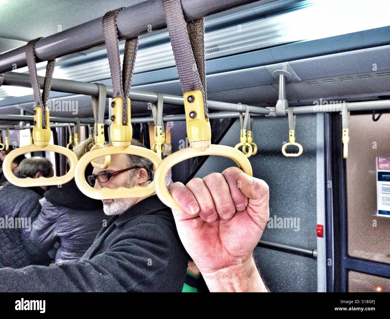 Handhold in a bus - Smartphone Captured Stock Image