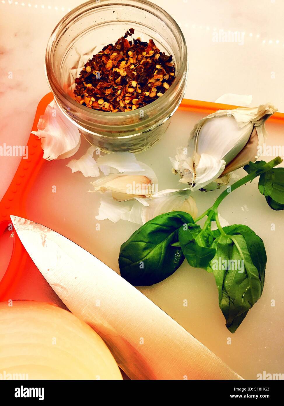 Cutting board and cooking ingredients in residential kitchen, USA - Smartphone Captured Stock Image