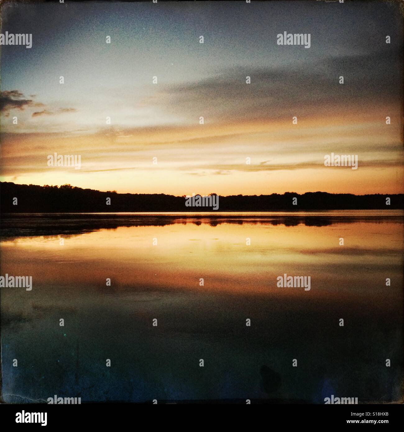 Sunset over the 100 acre pond in Mendon Ponds Park Mendon, NY - Smartphone Captured Stock Image