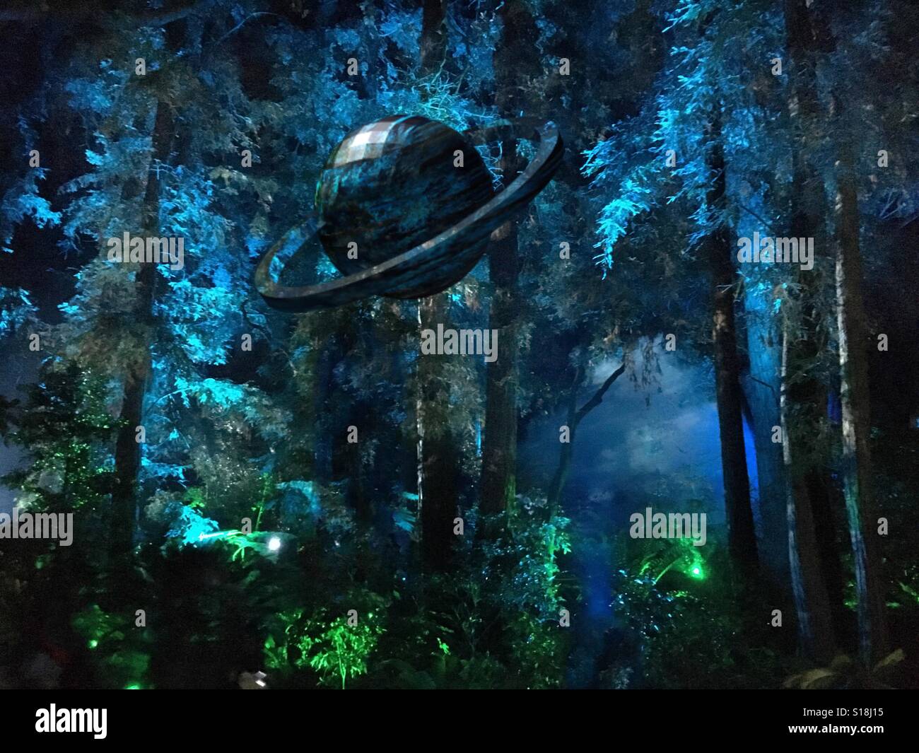 Saturn like planet in enchanted forest - Smartphone Captured Stock Image