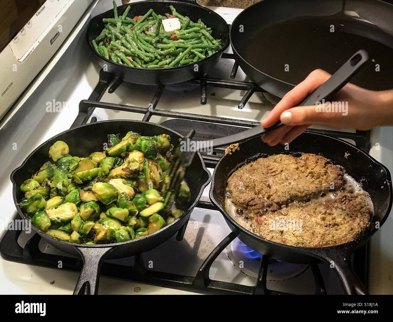 A wonderful whole foods meal being prepared by a young cook. Green
