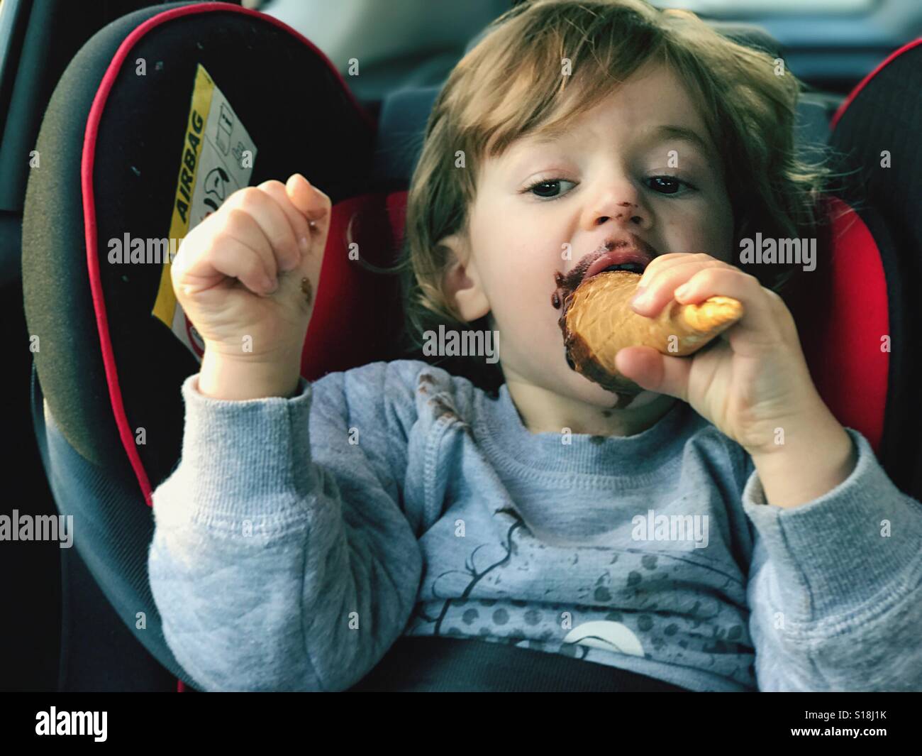 Children eating ice cream in the car - Smartphone Captured Stock Image