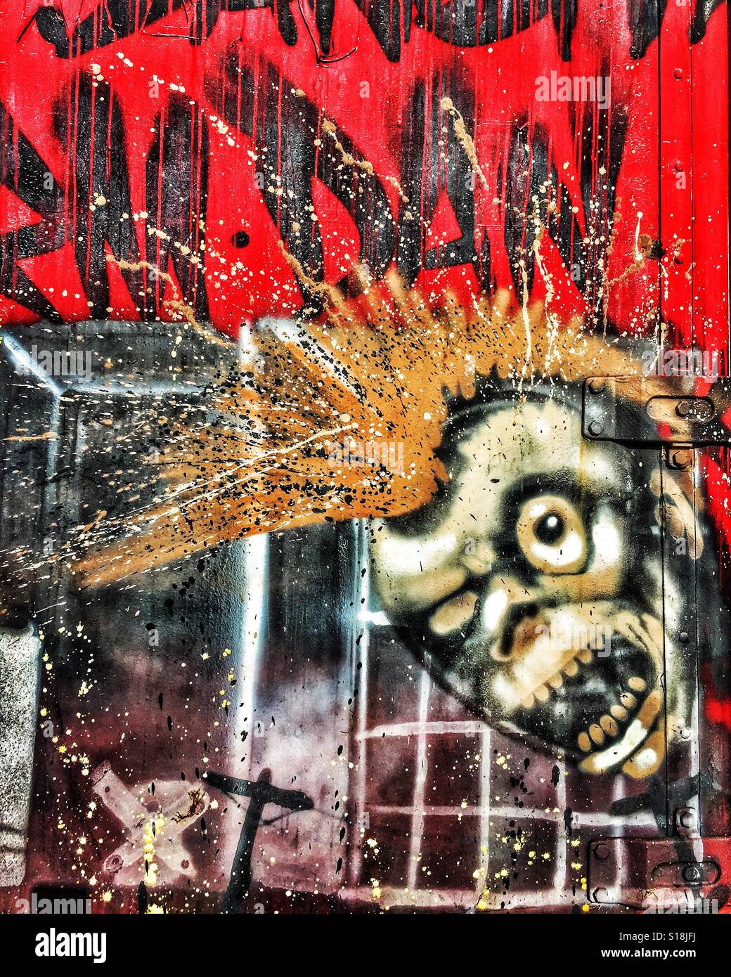 Bad hair day street art or graffiti of skull with Mohawk. Stock Photo