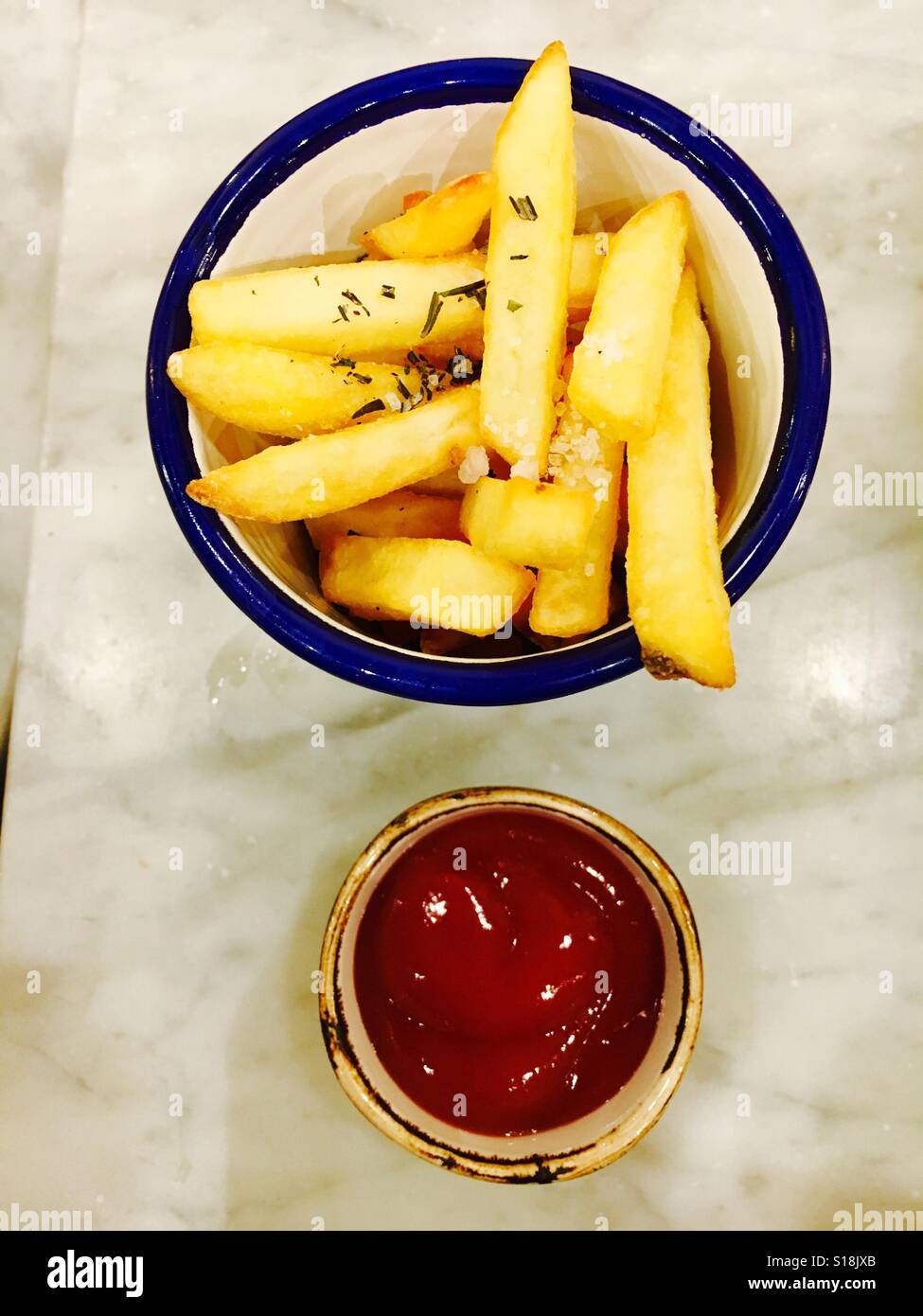Chips and tomato sauce Stock Photo Alamy