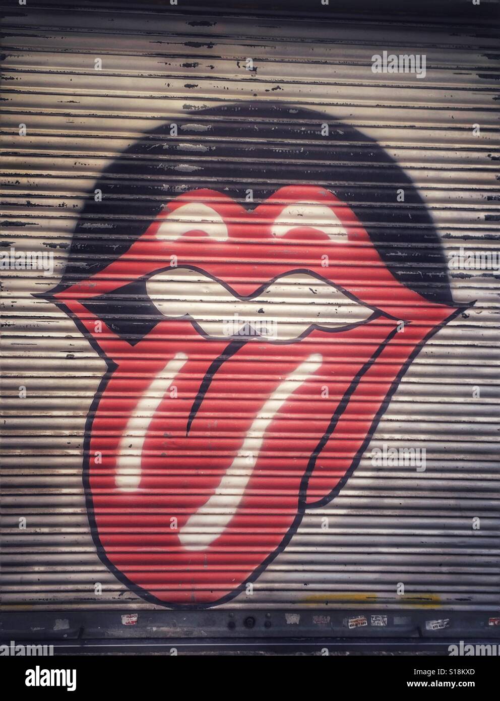 Rolling Stones motif graffitti on a shutter Stock Photo