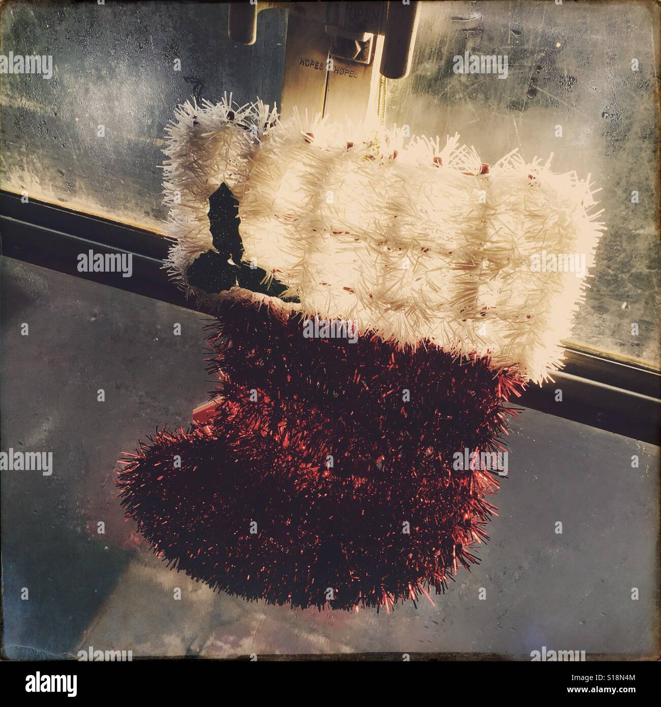 Santa's stocking hanging near a window on a train. North Yorkshire , England , UK - Smartphone Captured Stock Image