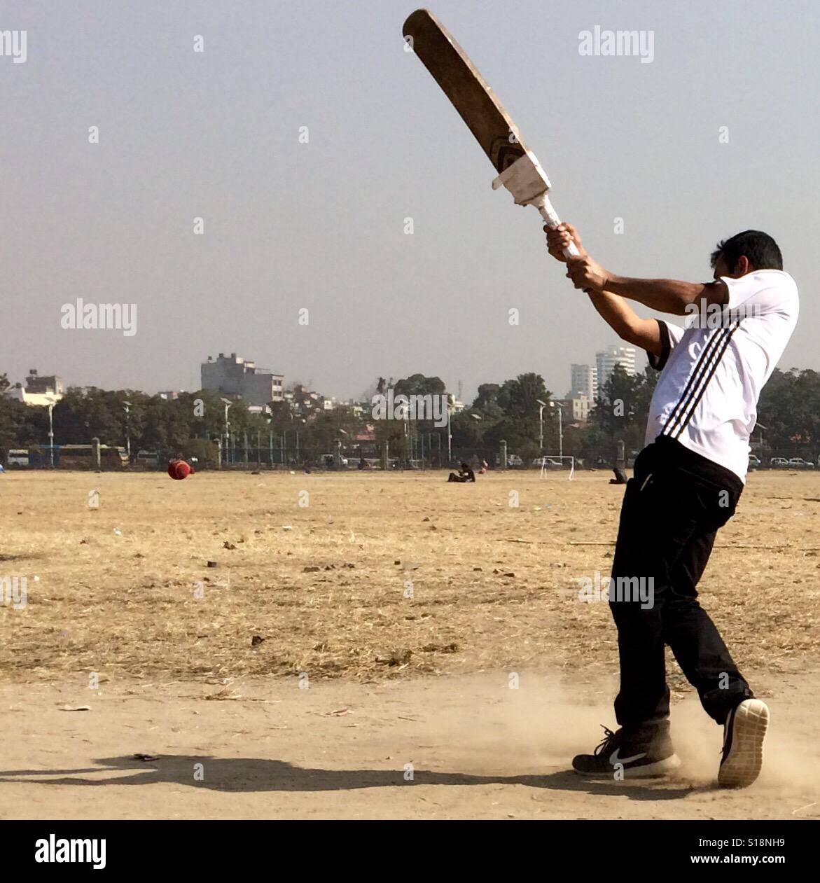 Cricket in the park, Kathmandu Stock Photo
