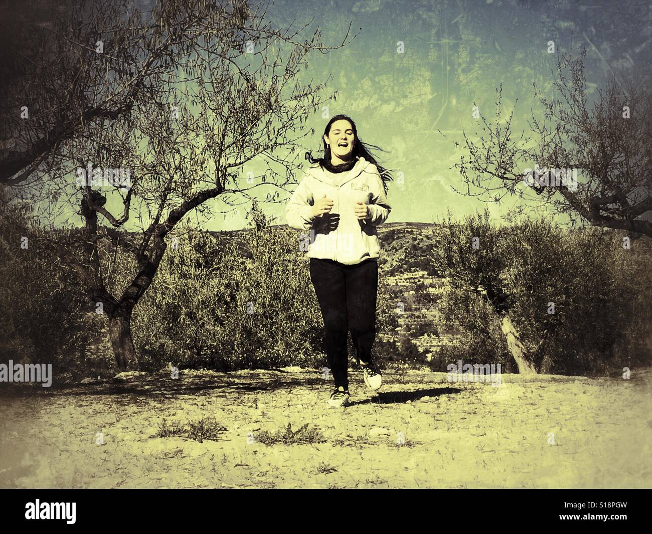 Teenager running outdoor - Smartphone Captured Stock Image