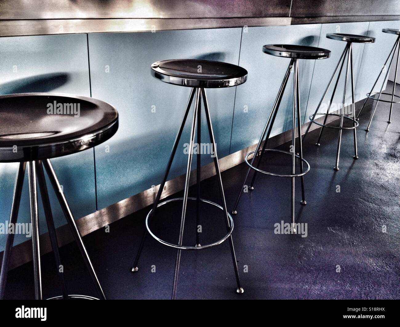 Breakfast bar stools in residential home, UK. - Smartphone Captured Stock Image
