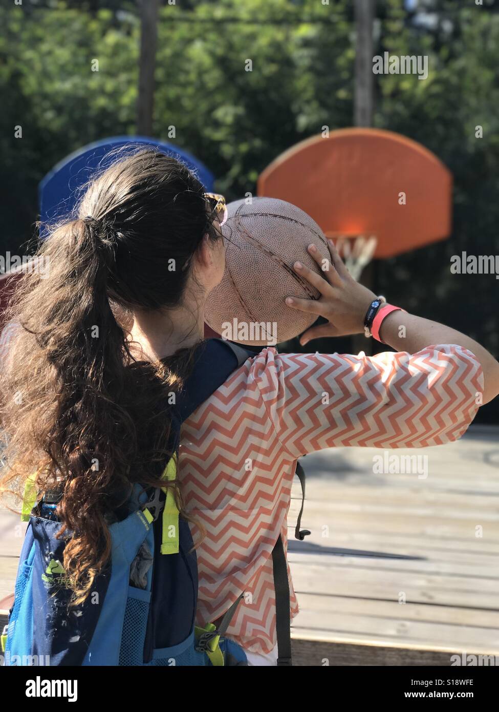 Girl throwing basketball Stock Photo Alamy