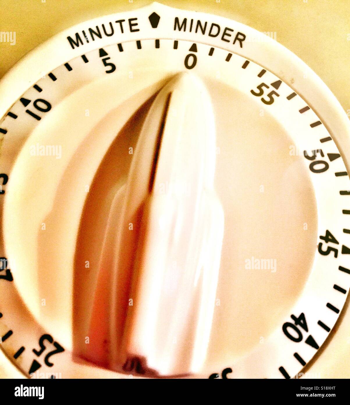 Plastic white kitchen timer counting down to zero, USA - Smartphone Captured Stock Image