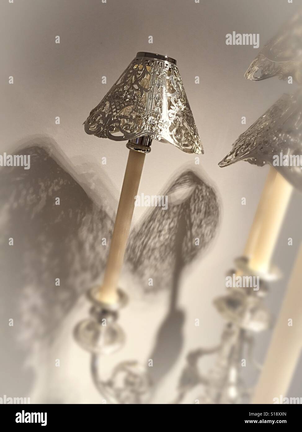 Silver candelabra with candle shades, USA - Smartphone Captured Stock Image