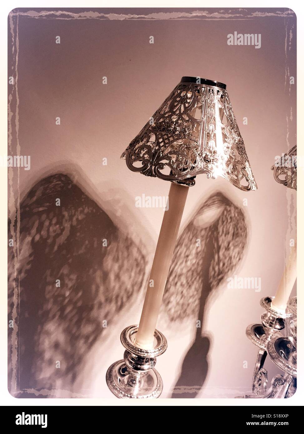 Silver candelabra with candle shades - Smartphone Captured Stock Image