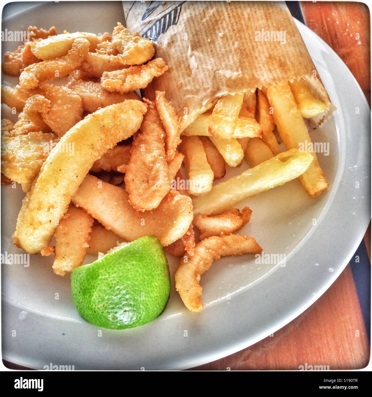 Calamari and chips from Snoekies restaurant, Hout Bay, Cape Town. - Smartphone Captured Stock Image