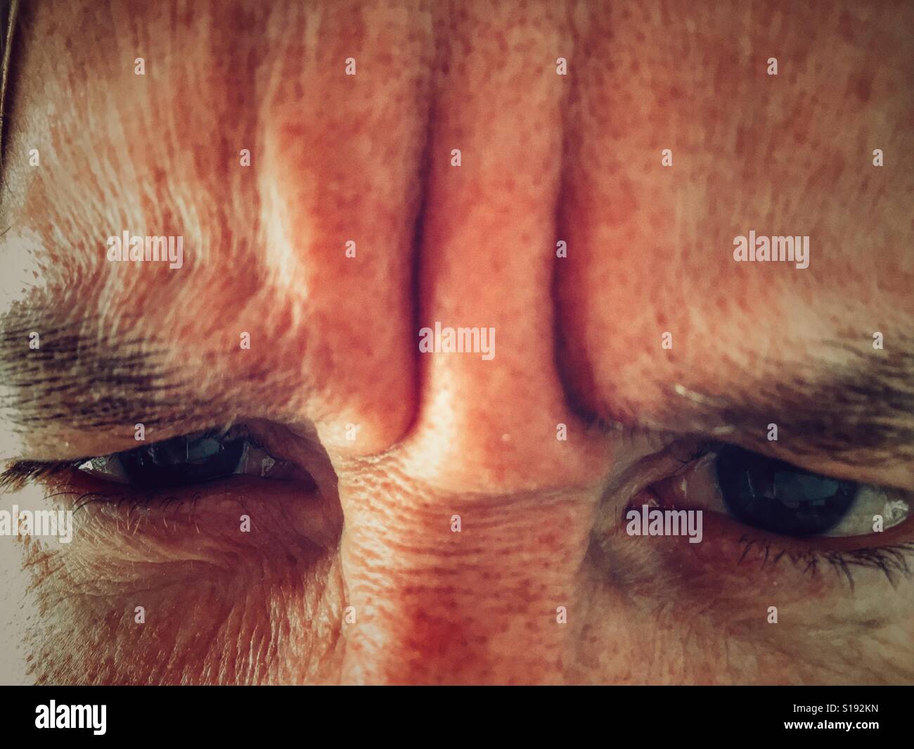 Adult frowning, close up - Smartphone Captured Stock Image