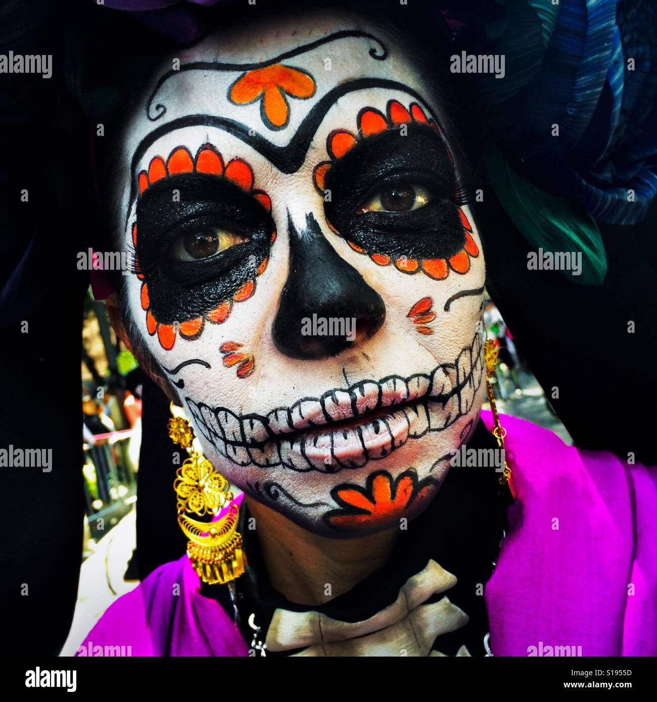 A young girl, representing a Mexican cultural icon called La Catrina, takes a part in celebrations of the Day of the Dead (Día de Muertos) in Mexico City, Mexico, 29 October 2016. Stock Photo