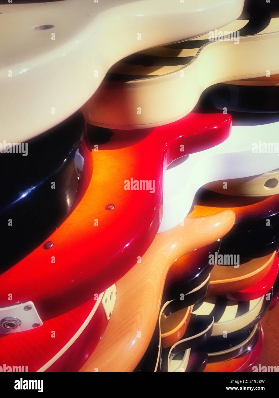 Display wall of electric guitar bodies, hard rock café, time square, NYC, USA - Smartphone Captured Stock Image