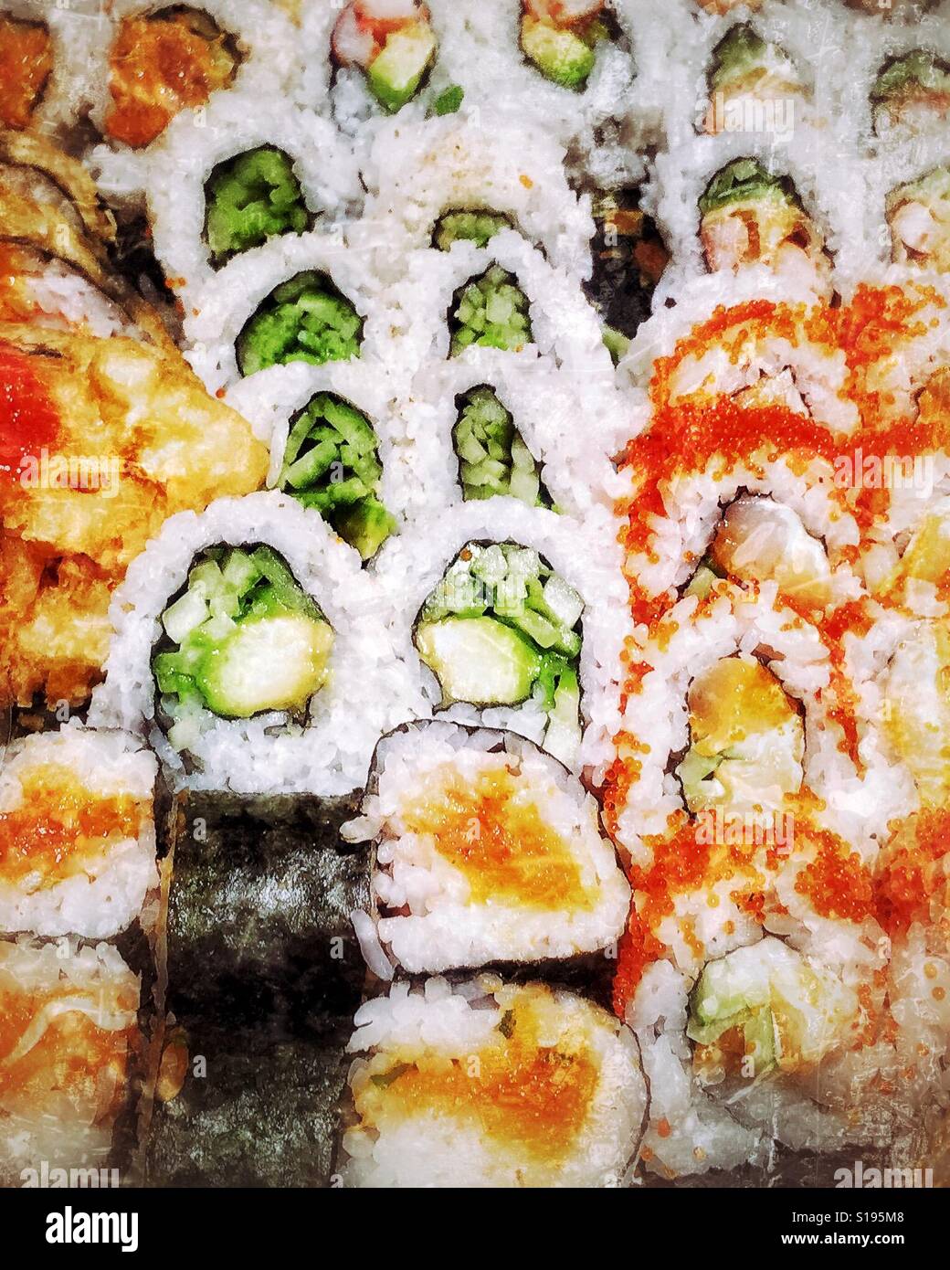 Close up of an assortment of sushi rolls. - Smartphone Captured Stock Image