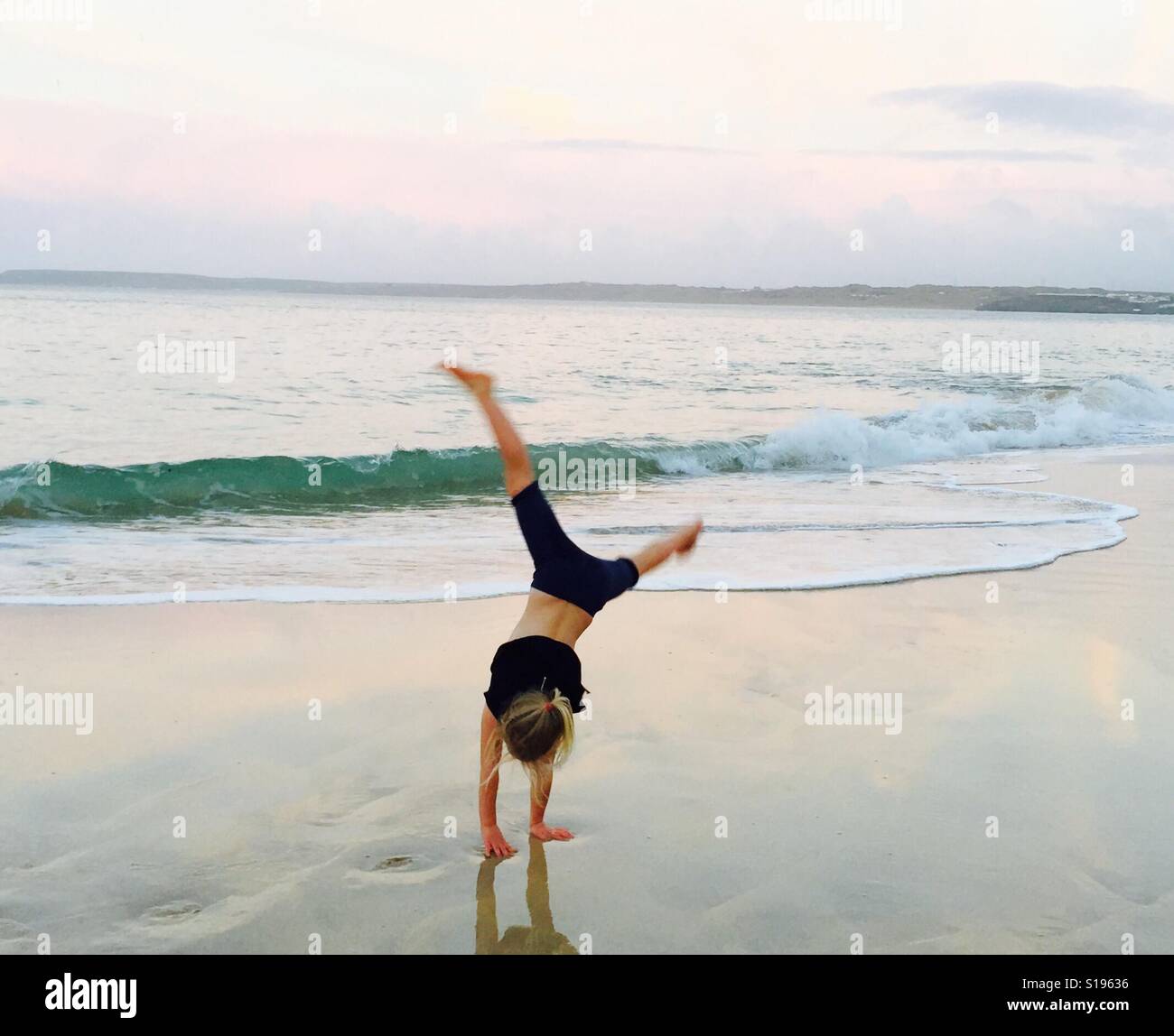 Cartwheels in the sand Stock Photo Alamy