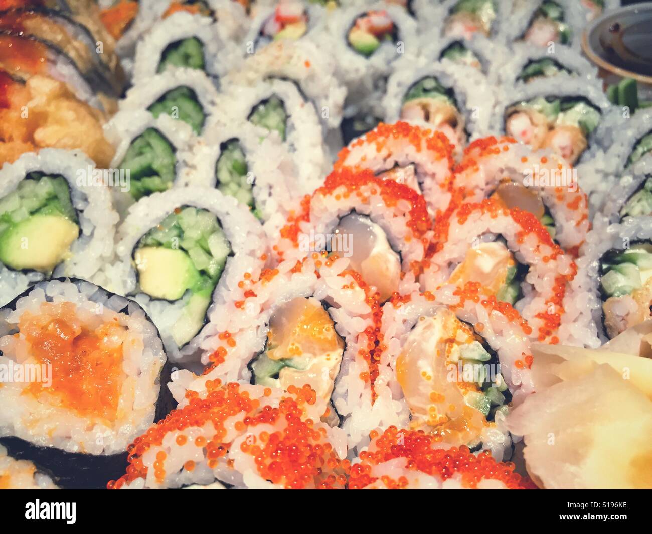 Close up image of an assortment of freshly prepared sushi rolls. - Smartphone Captured Stock Image