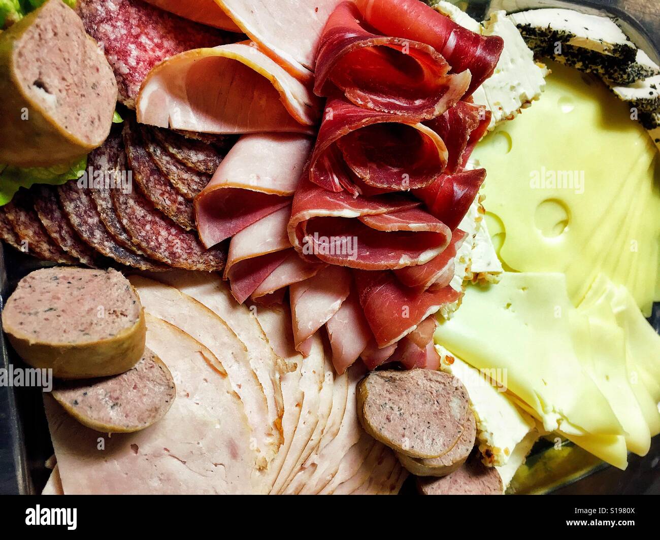 Breakfast plate with different types of cheese and meat cuts Stock Photo
