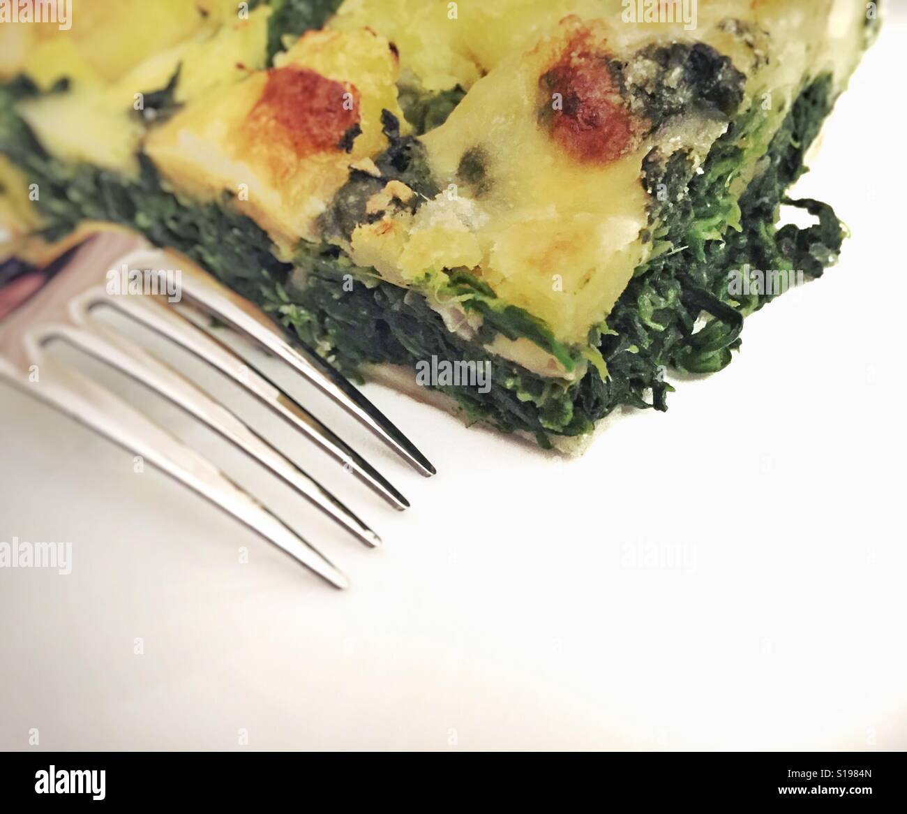 Close up of a spinach cake slice - Smartphone Captured Stock Image
