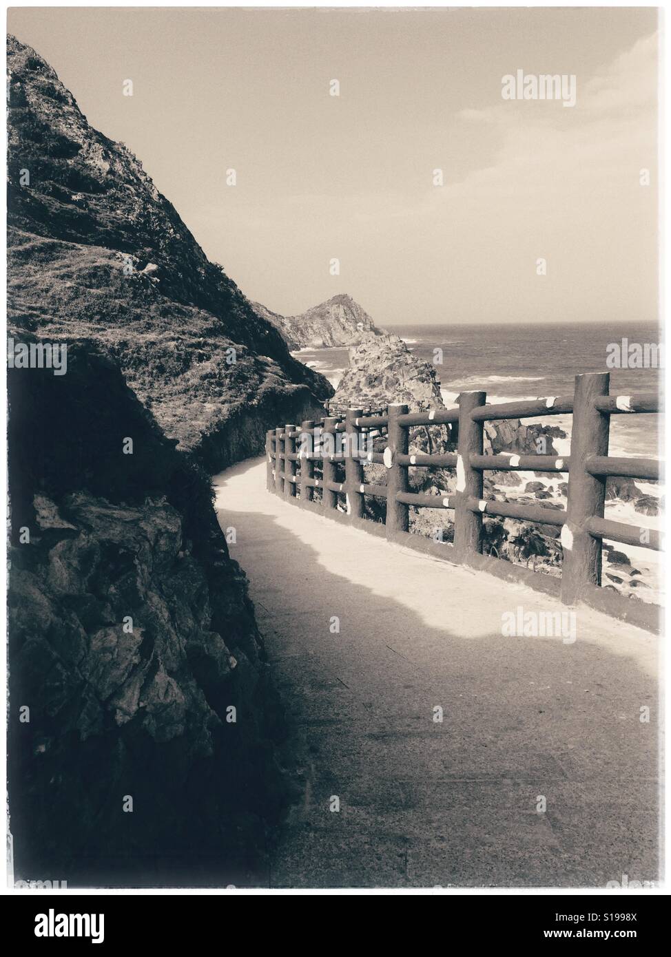 Down to the rocky beach. - Smartphone Captured Stock Image