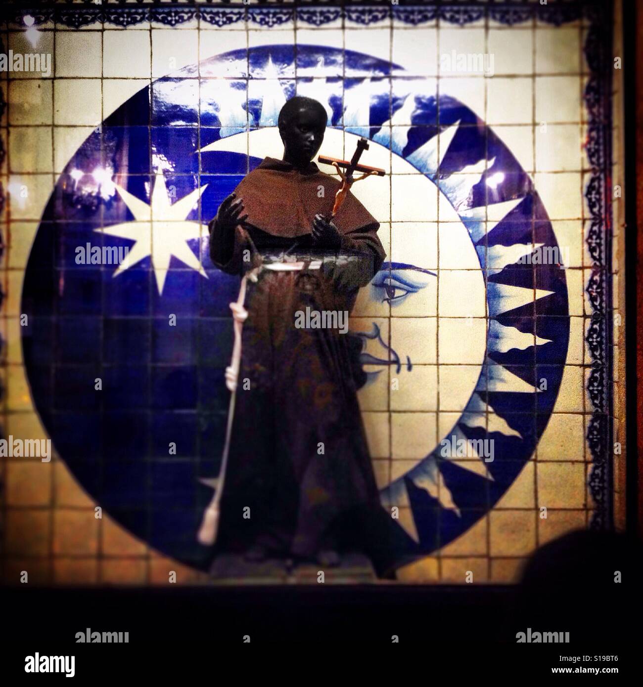 A sculpture of Saint Martin de Porres decorates Tepeyac hill's chapel in the Basilica of Our Lady of Guadalupe in Mexico City, Mexico - Smartphone Captured Stock Image